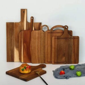 rectangular acacia wood cutting board with integrated hanging handle for chopping, serving, and food presentation