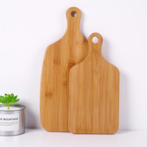large bamboo cutting board with rounded handle and hanging hole for food preparation and serving