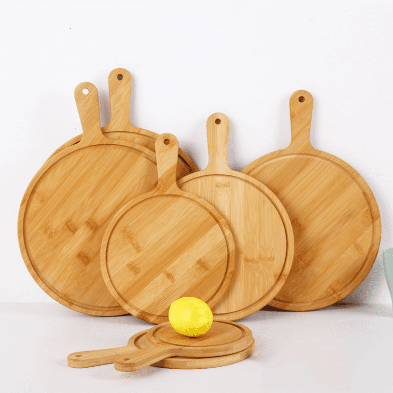 round bamboo pizza board with paddle handle and juice groove for serving pizza, cheese, bread and appetizers