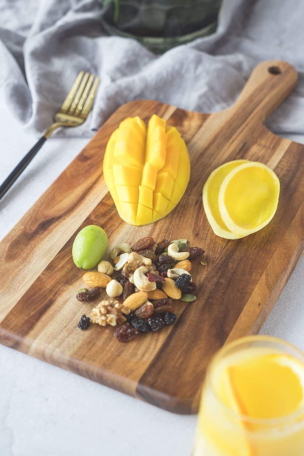 acacia wood cutting board with handle for pizza serving, cheese presentation, bread display and food preparation