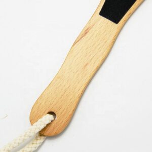 Double-faced wooden pedicure foot scrub with sandpaper surface for callus removal and smooth feet care.
