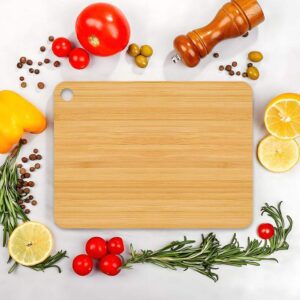 rectangular bamboo cutting board with hanging hole for chopping vegetables, fruits, and meat