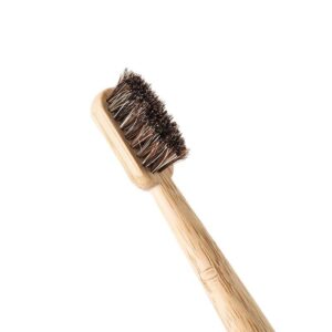 Four-piece bamboo toothbrush set with natural horse hair and boar bristle brush heads, custom logo bamboo handles, and eco-friendly kraft paper packaging for sustainable oral care