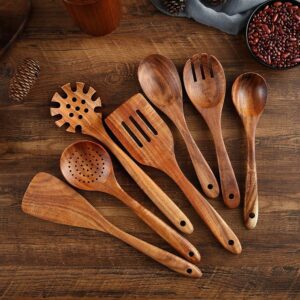 Seven-piece acacia wood cooking utensil set including spatulas, serving spoons, pasta server, slotted spoon, and cooking tools designed for non-stick cookware and kitchen use