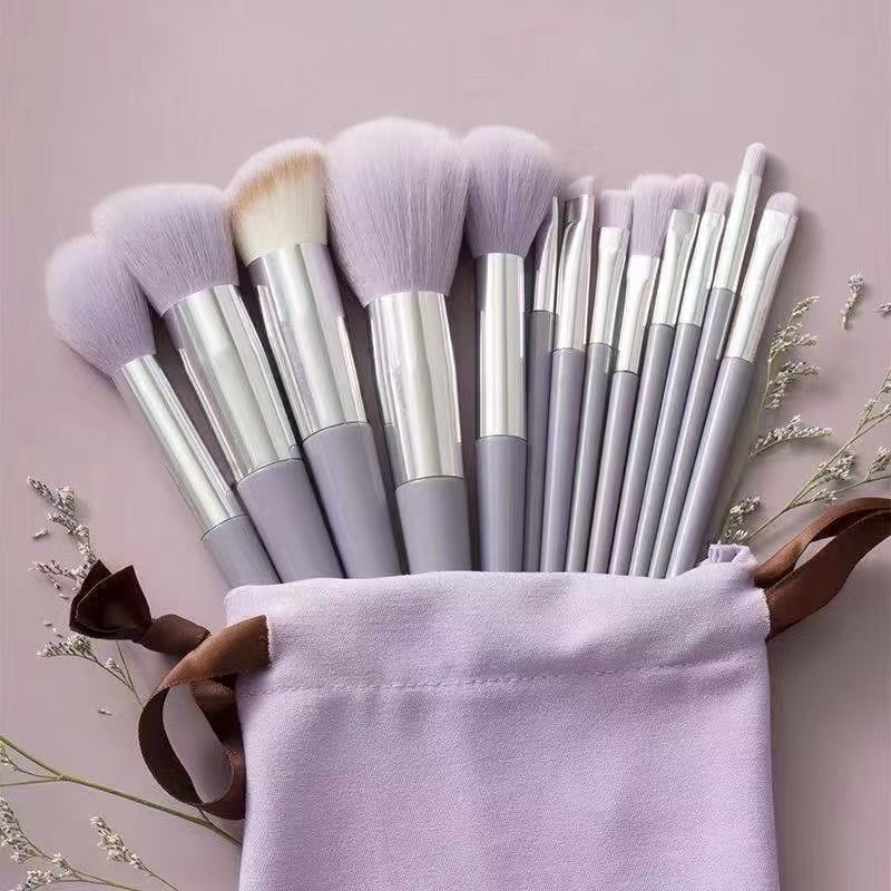 Professional green makeup brush set with storage pouch, featuring synthetic powder brushes, angular flat contour brushes, blending brushes, and precision eye makeup tools for flawless cosmetic application.