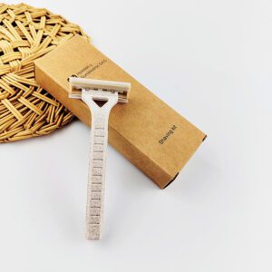 Wheat straw safety razor with 2-layer blade, eco-friendly shaving tool for hotels and personal care.