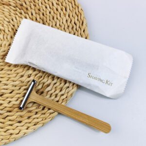 Bamboo system razor with dual stainless steel blades and natural wooden handle, designed for hotel amenities and sustainable shaving.
