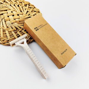 Wheat straw safety razor with 2-layer blade, eco-friendly shaving tool for hotels and personal care.