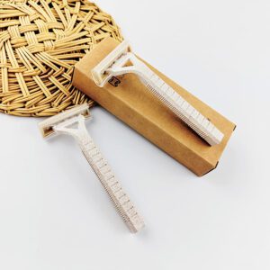 Wheat straw safety razor with 2-layer blade, eco-friendly shaving tool for hotels and personal care.