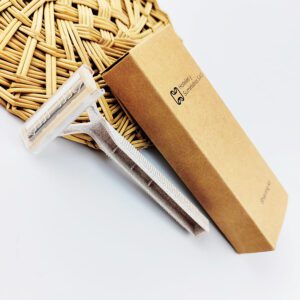 Wheat straw safety razor with 2-layer blade, eco-friendly shaving tool for hotels and personal care.