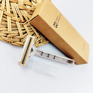 Wheat straw safety razor with 2-layer blade, eco-friendly shaving tool for hotels and personal care.