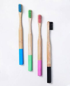Eco-friendly bamboo toothbrush travel set featuring a biodegradable bamboo toothbrush and reusable bamboo storage case, ideal for travel, camping, and daily oral care