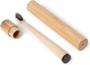 Eco-friendly bamboo toothbrush travel set featuring a biodegradable bamboo toothbrush and reusable bamboo storage case, ideal for travel, camping, and daily oral care