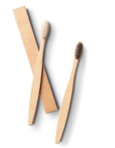 Eco-friendly bamboo toothbrush travel set featuring a biodegradable bamboo toothbrush and reusable bamboo storage case, ideal for travel, camping, and daily oral care