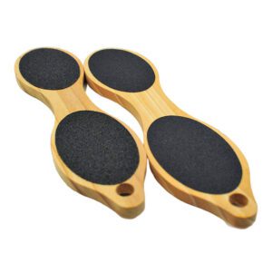Double-sided wooden foot file with sandpaper abrasive surface for removing calluses, hard skin, and rough heels during pedicure treatments