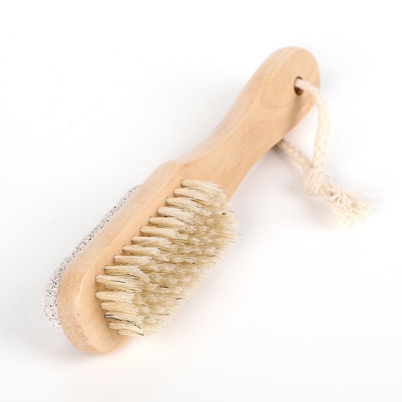 Wooden foot scrubber featuring natural boar bristles and pumice stone for exfoliating dead skin, cleaning feet, and removing calluses