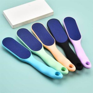 Long handle foot file with abrasive surface for removing calluses, hard skin, and rough heels during professional pedicure treatments