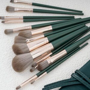 14-piece luxury makeup brush set featuring dark green wood handles, soft synthetic bristles, and professional face and eye brushes for foundation, concealer, powder, blush, and eyeshadow application.