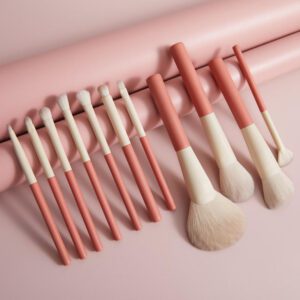 12-piece professional makeup brush set with pink and white handles, featuring synthetic hair brushes for face makeup, concealer, eyeshadow, mascara, blending, and fan brush application.