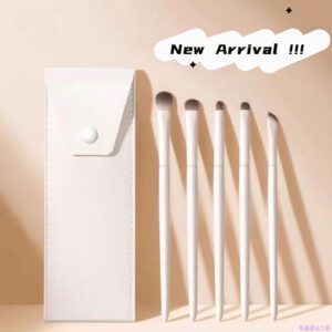 White makeup brush set with vegan synthetic bristles, including foundation, blending, eyeshadow, detail, and angled makeup brushes for precise cosmetic application and professional beauty routines.