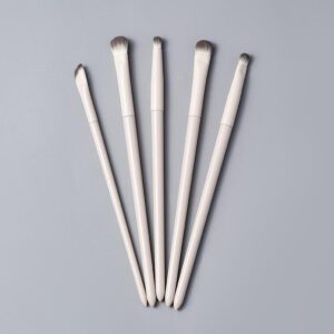 White makeup brush set with vegan synthetic bristles, including foundation, blending, eyeshadow, detail, and angled makeup brushes for precise cosmetic application and professional beauty routines.