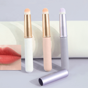 Portable lip brush with protective cap, synthetic bristles, and compact handle, designed for lipstick application, concealer touch-ups, and travel makeup use.