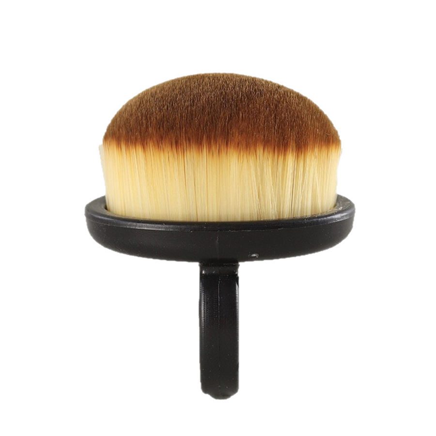 Compact round nail cleaning brush with soft synthetic bristles and black handle designed for removing nail art dust, powder, and manicure residue.