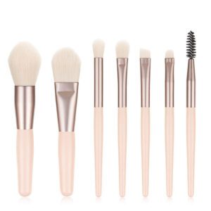 Pink makeup brush set featuring six professional cosmetic brushes for foundation, concealer, blush, eyeshadow, eyeliner, powder application, and eyebrow grooming with soft synthetic bristles.