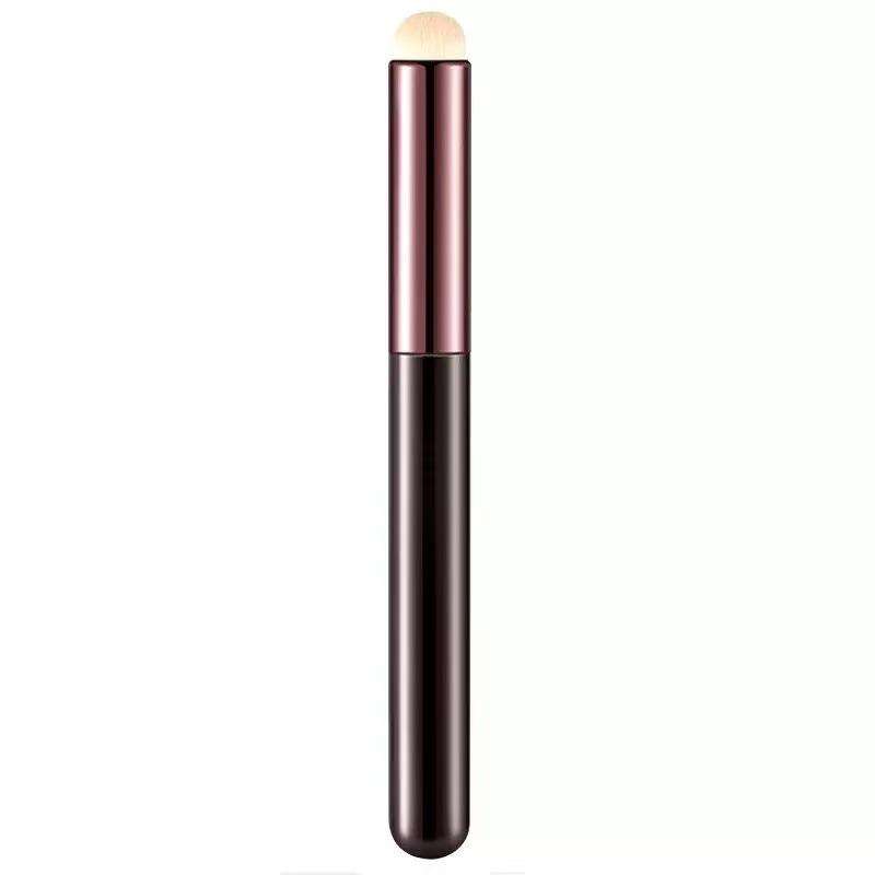 Compact multifunctional flat makeup brush with synthetic bristles and metallic handle, suitable for lipstick, lip gloss, concealer, and detailed facial makeup application.