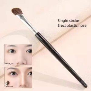 Reusable makeup brush with angled synthetic bristles, black handle, and aluminum ferrule, designed for eyelash application, eyeliner detailing, and precision beauty routines.