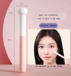 Portable concealer brush with soft mushroom sponge applicator and pink ABS handle, designed for blending concealer, lipstick, foundation, and cream cosmetics.