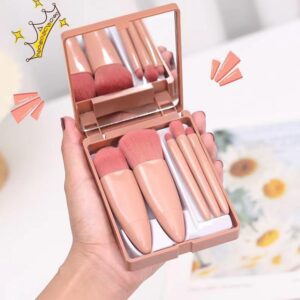 Compact travel makeup brush set with built-in mirror case, featuring soft pink synthetic brushes for foundation, powder, eyeshadow, blending, and daily beauty application.