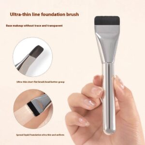 Professional flat foundation brush with ultra-thin dense synthetic bristles and silver handle, designed for seamless liquid foundation, contouring, and precise face makeup application.