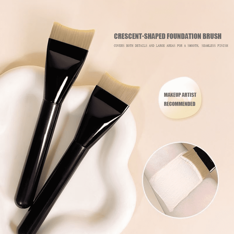 Professional tongue shaped foundation brush with soft synthetic bristles and black handle, designed for liquid foundation, facial masks, skincare products, and smooth face coverage.