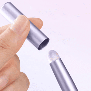 Portable lip brush with protective cap, synthetic bristles, and compact handle, designed for lipstick application, concealer touch-ups, and travel makeup use.