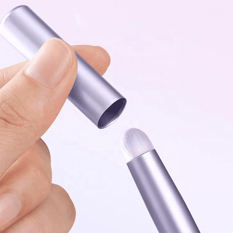 Portable lip brush with protective cap, synthetic bristles, and compact handle, designed for lipstick application, concealer touch-ups, and travel makeup use.