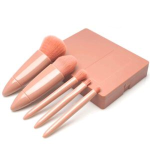 Compact travel makeup brush set with built-in mirror case, featuring soft pink synthetic brushes for foundation, powder, eyeshadow, blending, and daily beauty application.