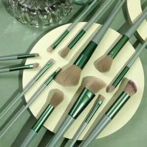 Professional green makeup brush set with storage pouch, featuring synthetic powder brushes, angular flat contour brushes, blending brushes, and precision eye makeup tools for flawless cosmetic application.