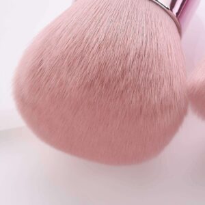 Compact fluffy makeup brush with ultra-soft pink synthetic bristles and a metallic handle, suitable for blush, bronzer, nail powder application, and manicure dust removal.