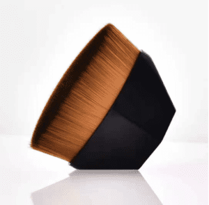 Portable magic foundation brush with dense synthetic bristles and ergonomic black handle, designed for foundation, contouring, concealer blending, and flawless makeup application.