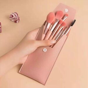 Pink makeup brush set featuring six professional cosmetic brushes for foundation, concealer, blush, eyeshadow, eyeliner, powder application, and eyebrow grooming with soft synthetic bristles.