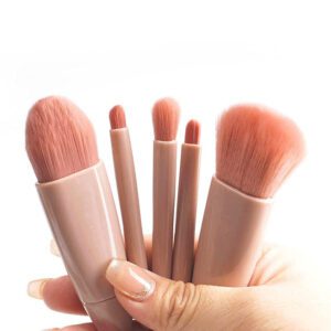 Compact travel makeup brush set with built-in mirror case, featuring soft pink synthetic brushes for foundation, powder, eyeshadow, blending, and daily beauty application.