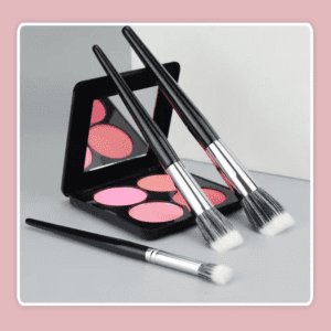 Professional stippling makeup brush with soft synthetic bristles, silver ferrule, and black handle, designed for blush, foundation, concealer, and cream makeup application.